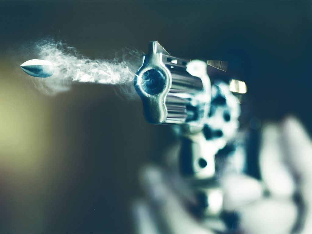 gun firing a bullet