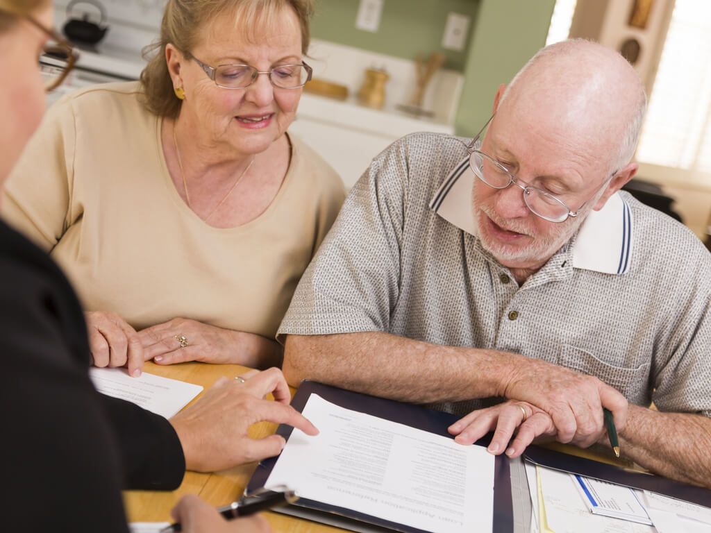 elderly couple looking over estate plans