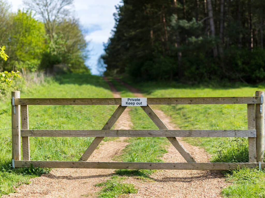 a gate closed in front of a right of way on a property