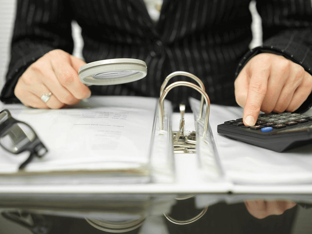 an accountant reviewing for tax evasion
